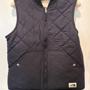 The North Face women’s Black Quilted Vest.